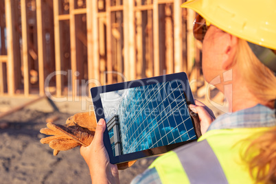 Female Construction Workers Reviewing Building on Computer Pad a