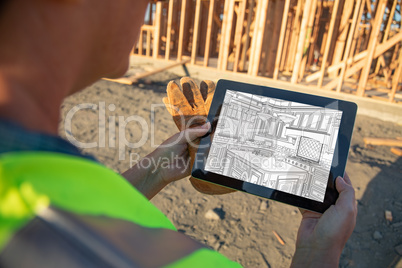 Female Construction Worker Reviewing Kitchen Drawing on Computer