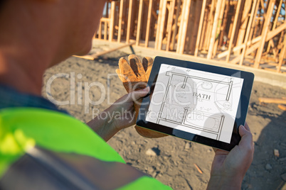 Female Construction Workers Reviewing House Plans on Computer Pa