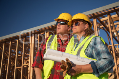 Male and Female Construction Workers at Construction Site