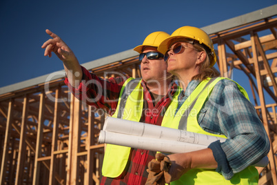 Male and Female Construction Workers at Construction Site
