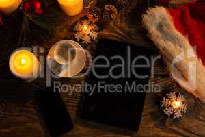 digital tablet and smartphone with Christmas ornament