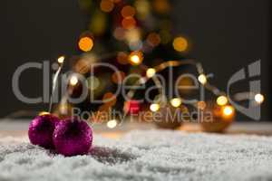 Christmas balls against unfocused tree