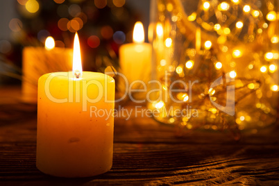 Christmas candles on wooden table