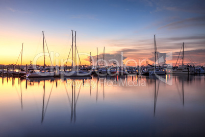 Sunrise over a quiet harbor in old Naples, Florida