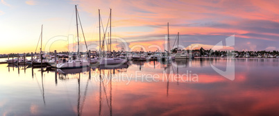 Sunrise over a quiet harbor in old Naples, Florida