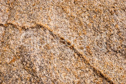 Natural granite stone with a unique pattern of inclusions of quartz veins