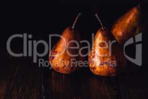 Golden Pears on Wooden Table