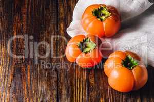 Three Persimmons on Table