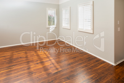 Newly Installed Brown Laminate Flooring and Baseboards in Home