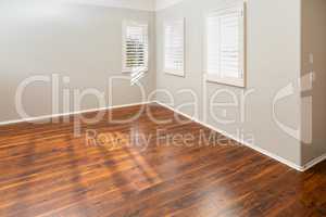 Newly Installed Brown Laminate Flooring and Baseboards in Home