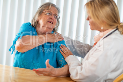 Senior Adult Woman Talking with Female Doctor About Sore Shoulders