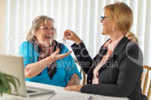 Senior Adult Woman Getting House Keys From Real Estate Agent Nea