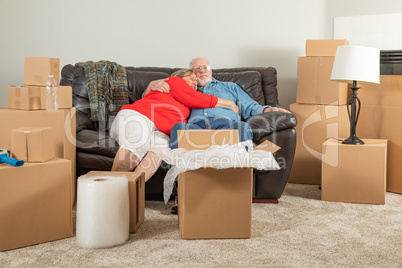 Affectionate Tired Senior Adult Couple Resting on Couch