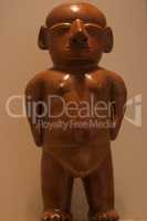 Inca ancient statue of a naked man.