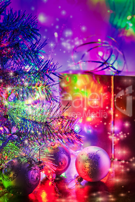 Christmas tree, balls, box, lit by fairy lights