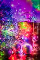 Christmas tree, balls, box, lit by fairy lights