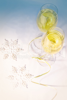 Two glasses of wine and snowflakes