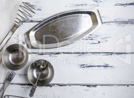 kitchen empty metal objects on a white wooden background