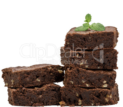 two stacks with square baked pieces of chocolate brownie with wa