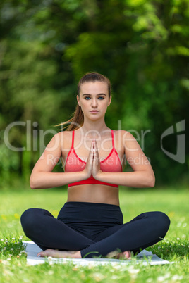 Female Young Fit Healthy Woman or Girl Practicing Yoga Outside