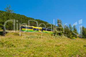 Train moves in the mountains of Switzerland