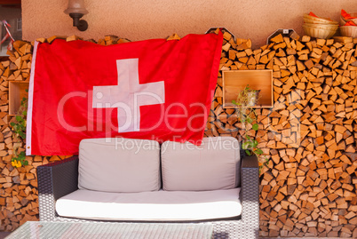 The design of wooden chalets in the national style and the mandatory flag of Switzerland