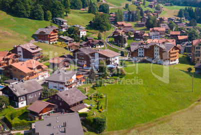 Landscape with the small mountain town of Wengen in the summer, the view from the top. Switzerland