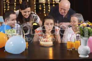 Happy family celebrating teenager girl anniversary