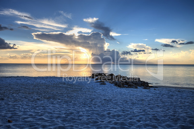 Sunset over the white sand on Naples Beach in Naples, Florida