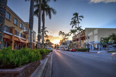 Sunset over the shops along 5th Street in Old Naples, Florida.