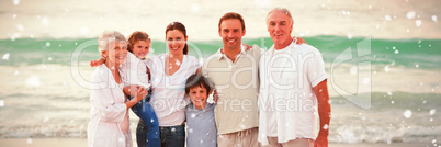 Composite image of beautiful family at the beach