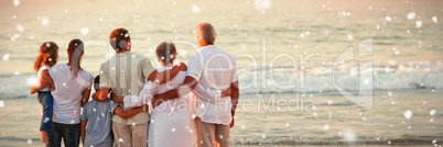 Composite image of beautiful family at the beach