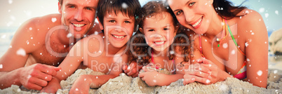 Composite image of family at the beach