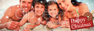 Composite image of family at the beach