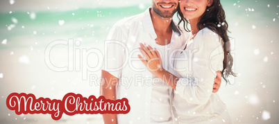 Composite image of happy couple looking at camera