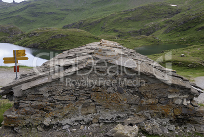 old stone Chalet on the shore of a small lake in the Alpine mountains. Grindelwald Switzerland