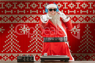 Composite image of santa claus mixing sound