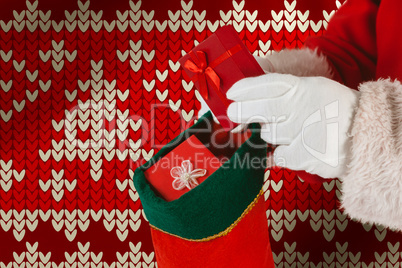 Composite image of santa claus putting presents in christmas stockings