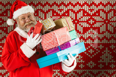 Composite image of portrait of cheerful santa claus holding christmas presents