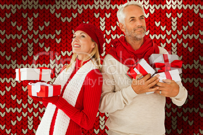 Composite image of happy festive couple with gifts