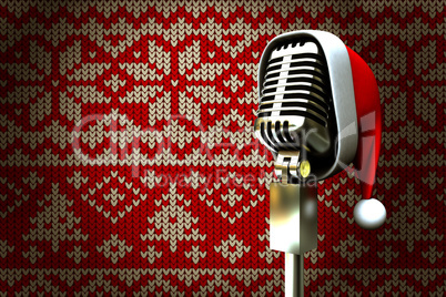 Composite image of retro microphone with santa hat