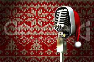 Composite image of retro microphone with santa hat