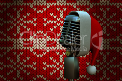 Composite image of retro microphone with santa hat