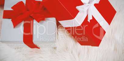 Christmas gifts on a white fur carpet