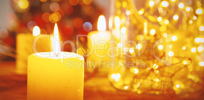 Christmas candles on wooden table