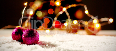 Christmas balls against unfocused tree