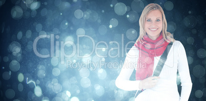 Composite image of portrait of a delighted student with scarf smiling at the camera