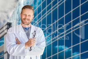 Handsome Young Adult Male Doctor With Beard In Front of Hospital