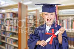 Cute Young Caucasian Boy Wearing Graduation Cap and Gown in The